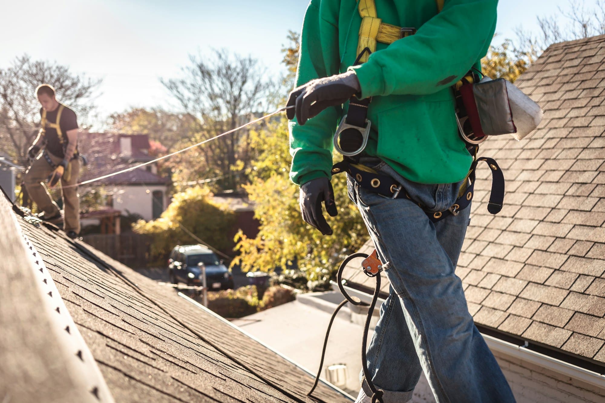 Solar panel installation crew on roof of house